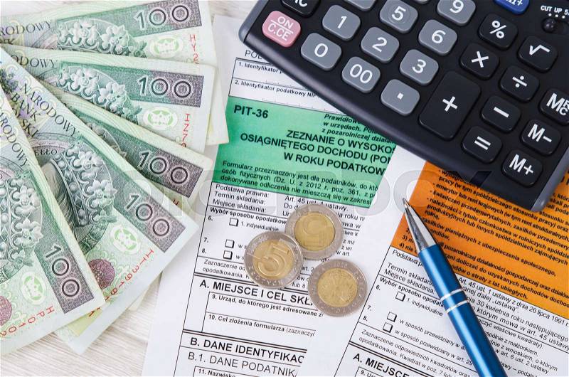 Polish tax form with cash and calculator. Accounting pit business polish zloty concept, stock photo