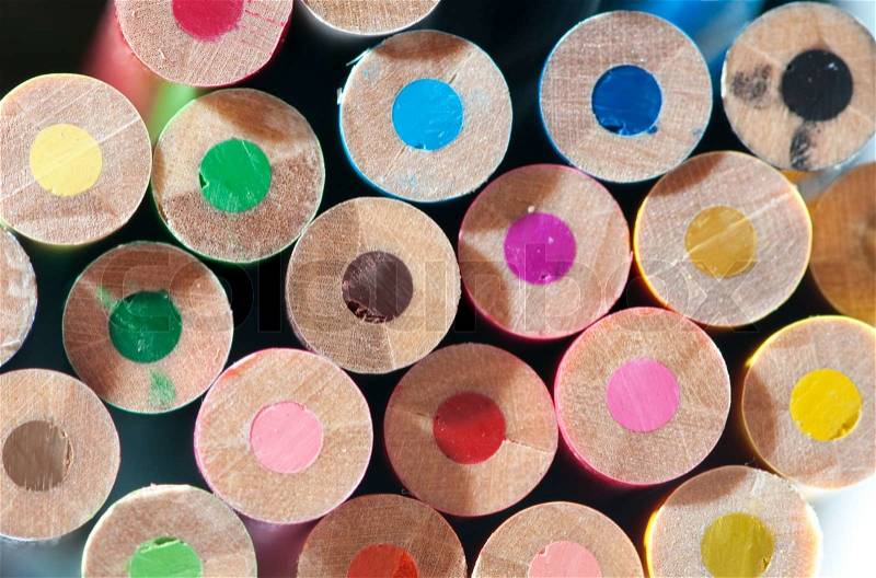 Colorful background pattern from disordered circle pencils, stock photo