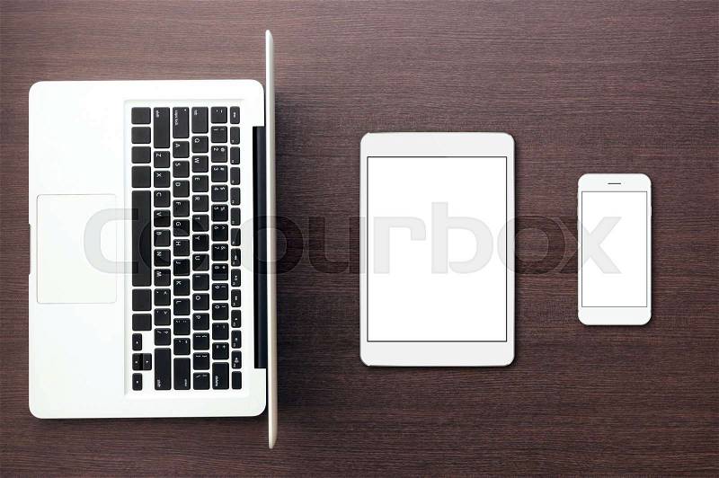Aptop tablet and phone on desk top view, mock-up tablet and phone, stock photo