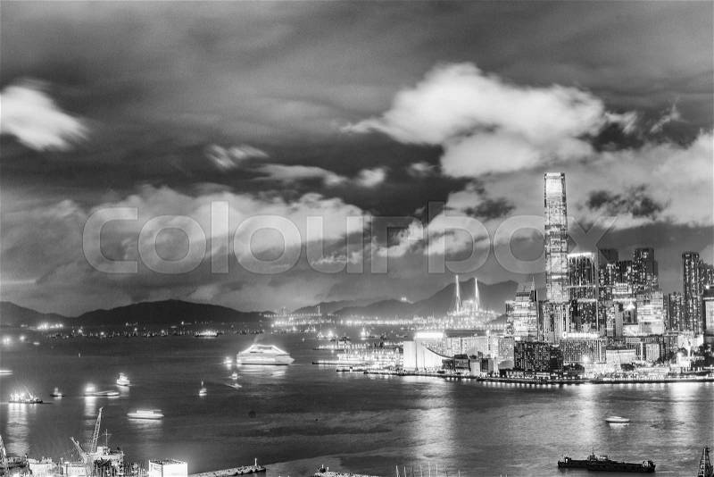 HONG KONG - APRIL 2014: Panorama of Hong Kong at night. With a land mass of 1,104 km and population of 7 million people, Hong Kong is one of the most densely populated areas in the world, stock photo