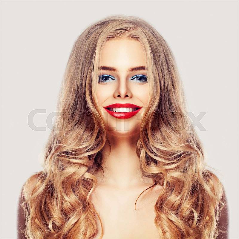Beautiful Woman with Long Healthy Blonde Hair, Makeup and Cute Smile Laughing, stock photo