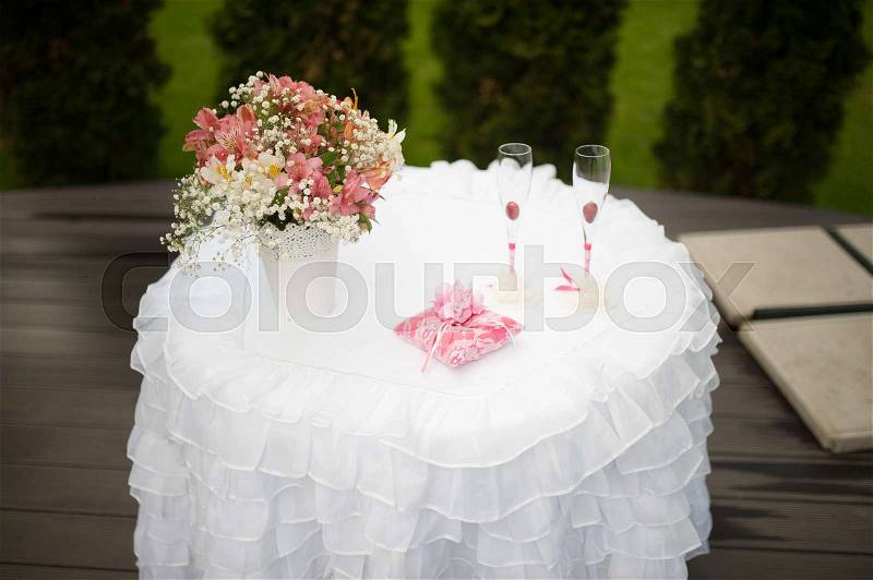 Wedding decor table at restaurant with all beauty and flowers, stock photo