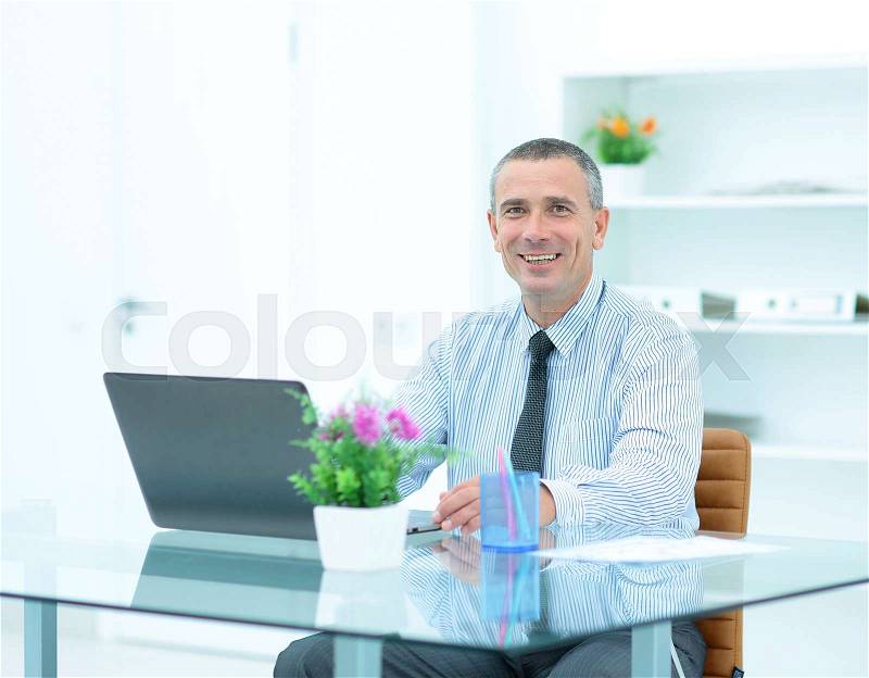 Closeup of a lawyer in front of an open laptop sitting in the office at the workplace. in the photo there is an empty space for your text, stock photo