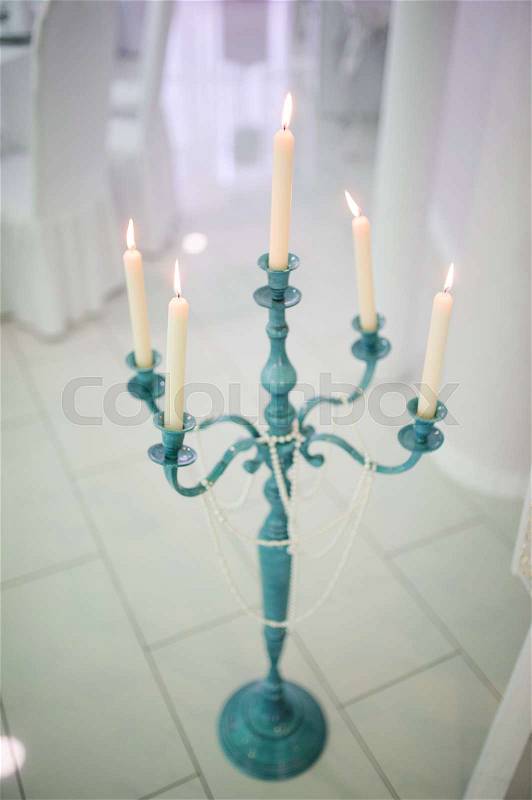 Wedding decor candle at restaurant with all beauty and flowers, stock photo