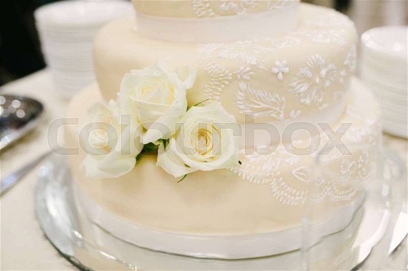 Wedding cake decorated with roses, stock photo