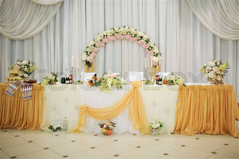 Banquet wedding table setting on evening reception awaiting guests, stock photo