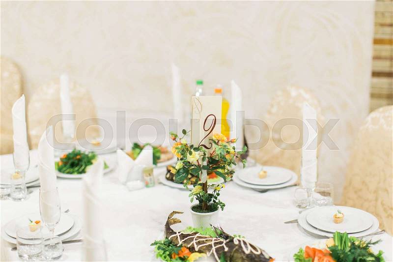 Banquet wedding table setting on evening reception, stock photo