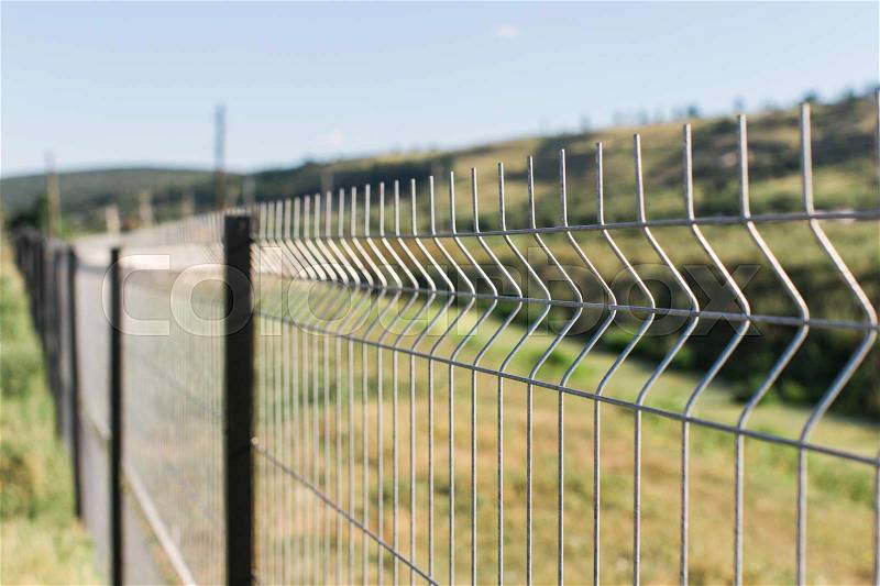 Border or private zone with wire fence, stock photo