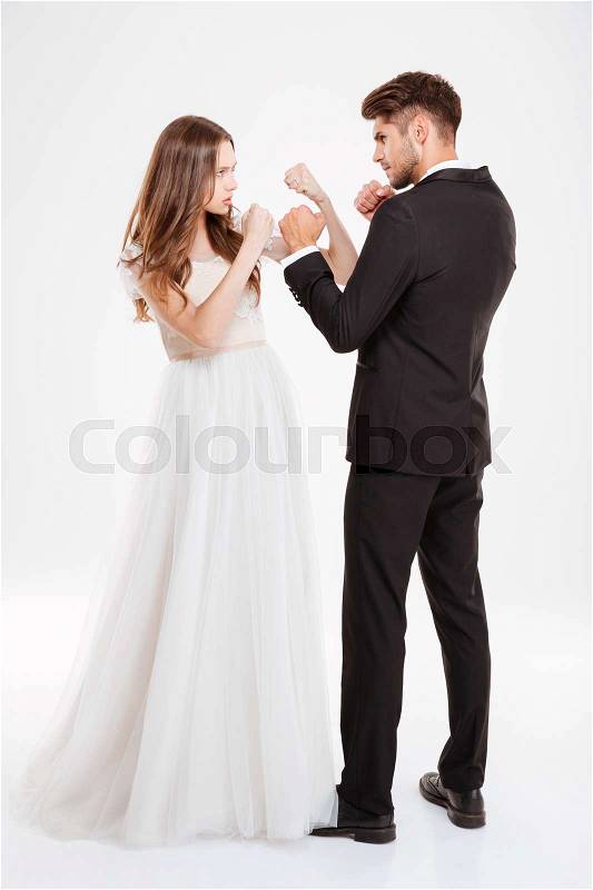 Full lenght portrait of couple fight. isolated white background, stock photo