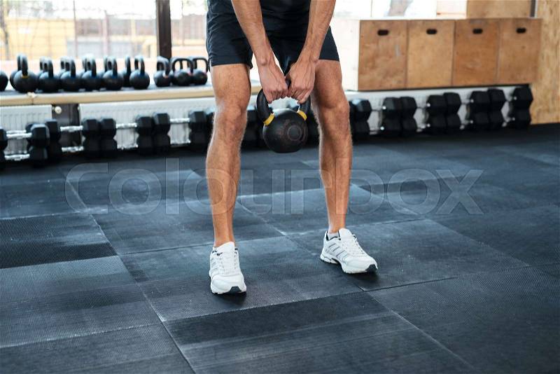 Cropped image of man with weight. doing exercise, stock photo