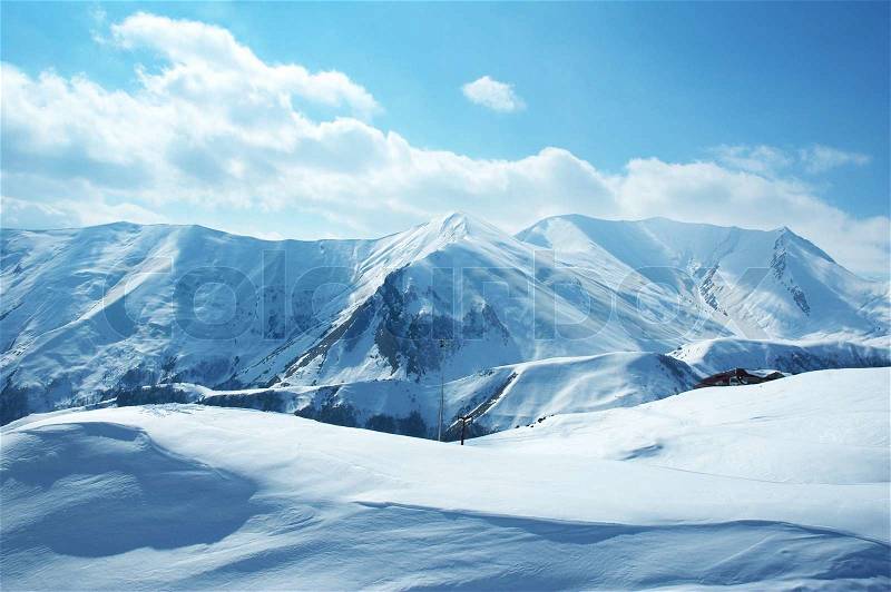 Mountains under the snow on a winter day, stock photo