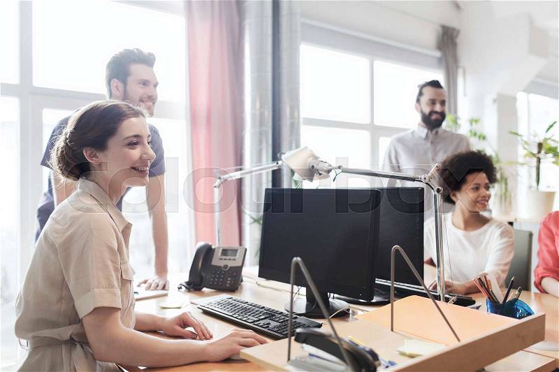 Business, startup and people concept - happy creative team in office, stock photo