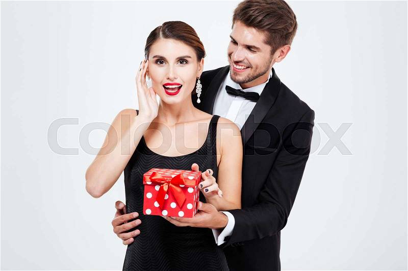 Happy business couple with gift. woman so happy. isolated white background, stock photo