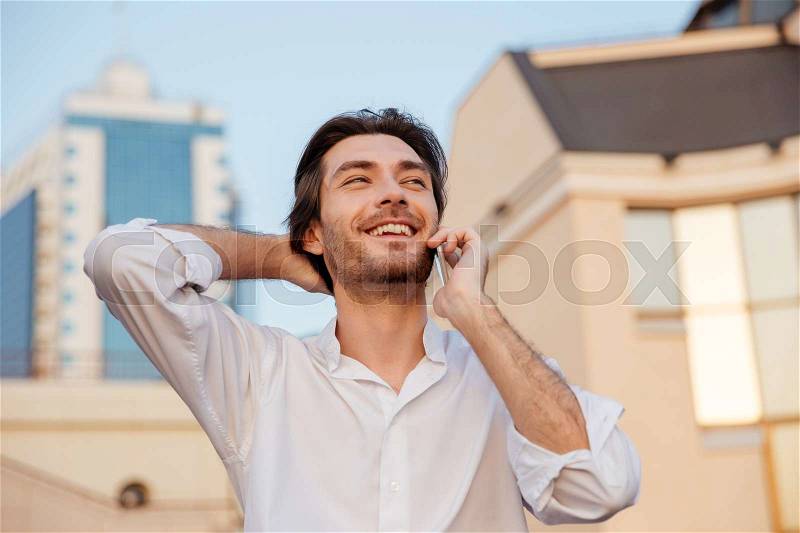 Happy man in shirt with phone. close up portrait, stock photo