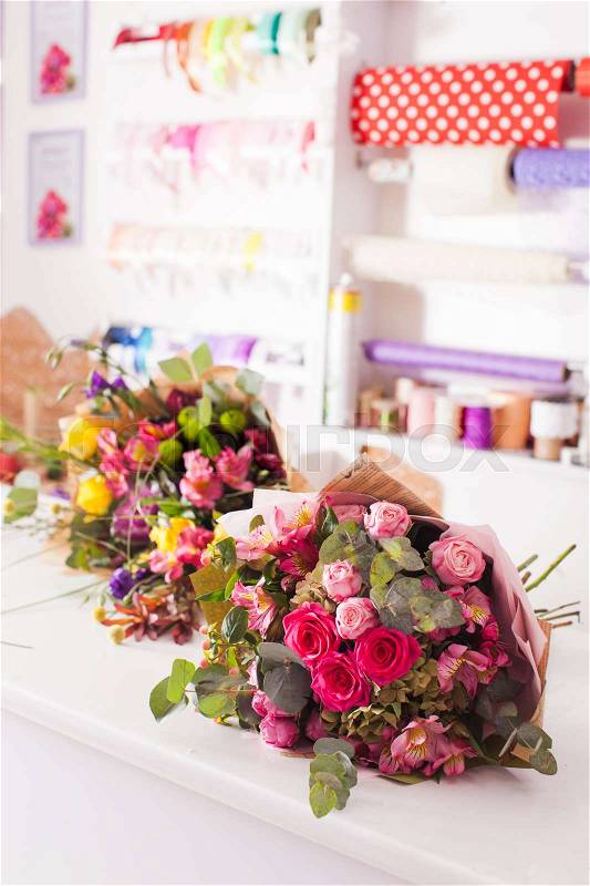 Finished bouquets on the table in the flower shop, stock photo