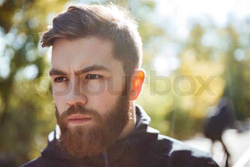 Close up image of runner in park. looking away, stock photo