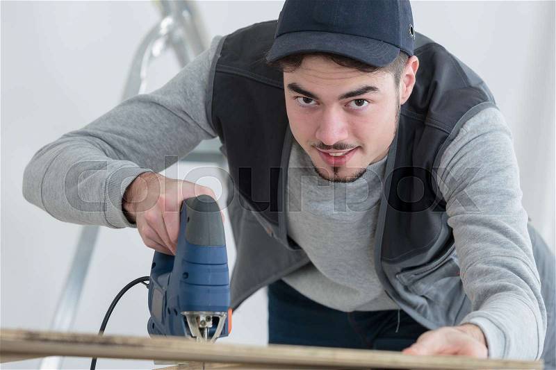Handyman at work, stock photo