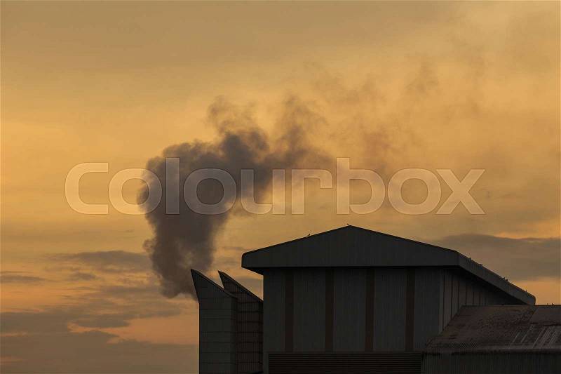 Industrial smoke from chemical factory in Thailand, Warm tone color, stock photo