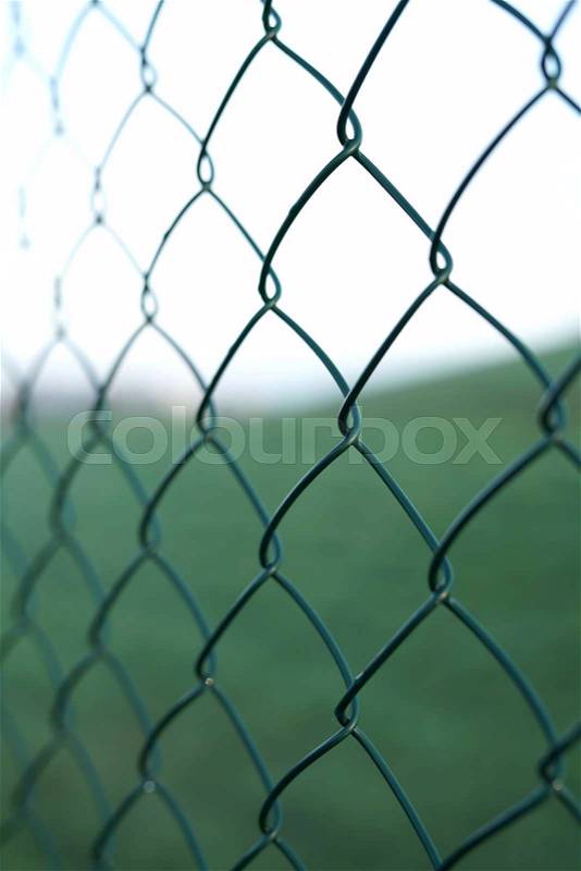 Wire mesh fence on a private land, stock photo