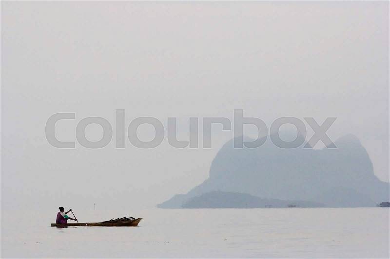 People rowing boat at Semporna, Sabah, Malaysia, stock photo