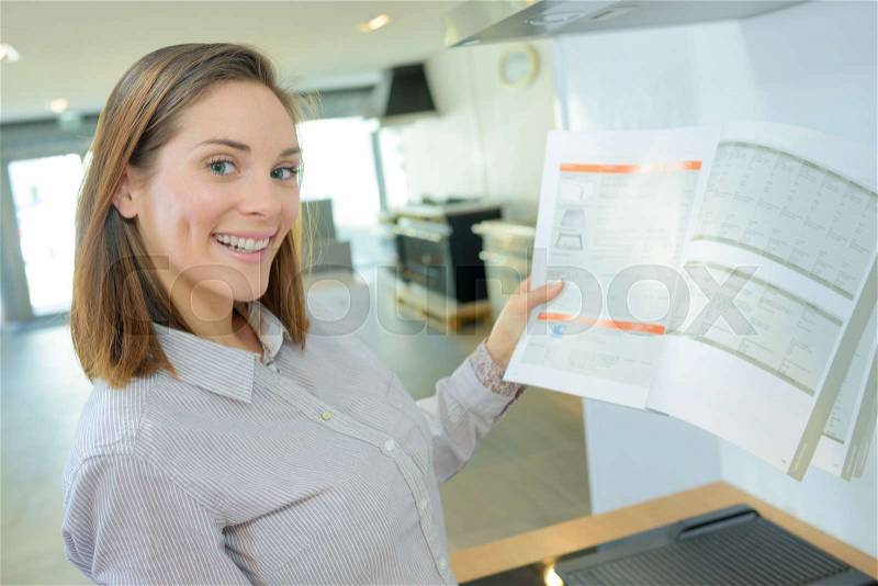 Happy woman buying a flat, stock photo