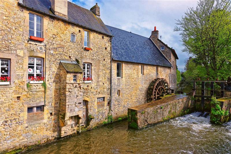 Water mill and Aure River in the old city in Bayeux in Calvados department of Normandy, France, stock photo
