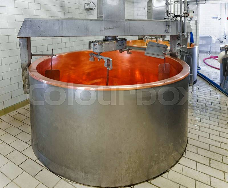 Empty tank for Processing of Gruyere de Comte Cheese at the dairy in Franche Comte, Burgundy, in France, stock photo