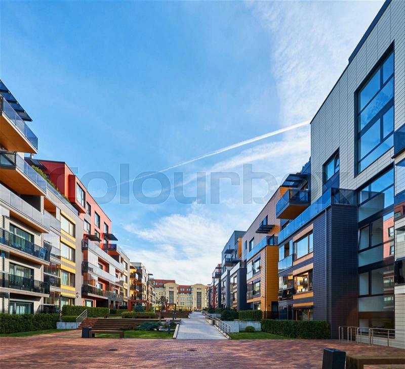 Modern complex of apartment residential buildings. Benches and outdoor facilities, stock photo
