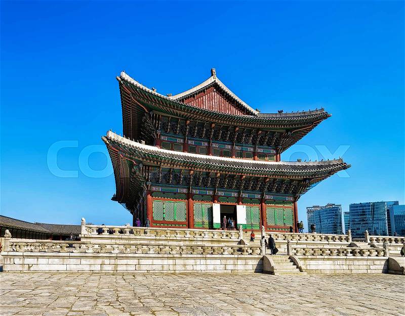 Throne Hall and people at Gyeongbokgung Palace of Seoul, South Korea, stock photo