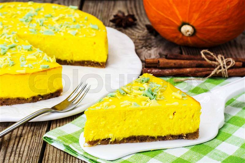 A popular dessert-homemade pumpkin cheesecake on wooden background.Studuo Photo, stock photo