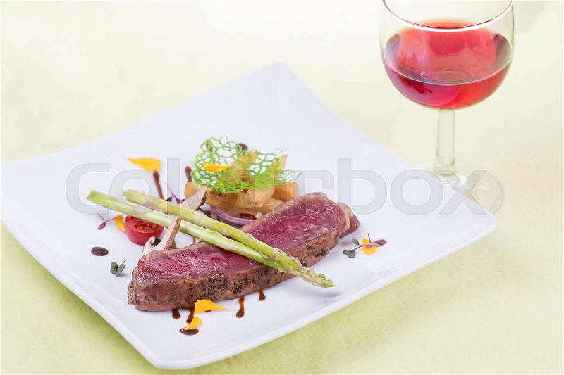 Beef Steak on the plate and red wine, stock photo