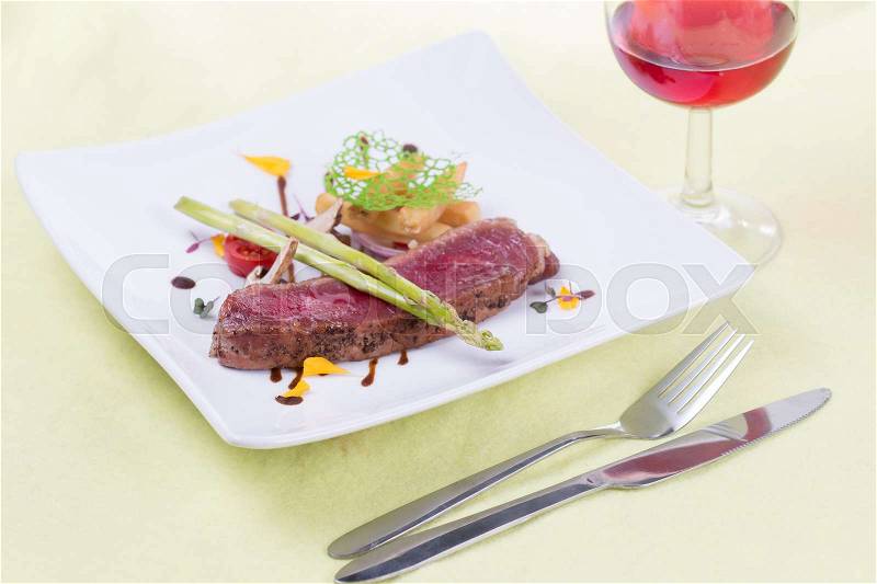 Beef Steak on the plate and red wine, stock photo