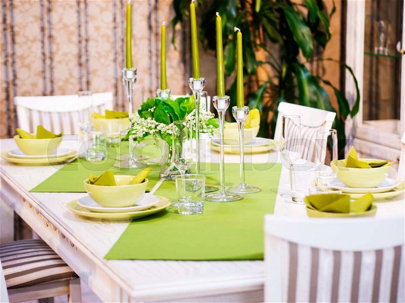Beautiful table setting with white and green colors. Shallow DOF, stock photo