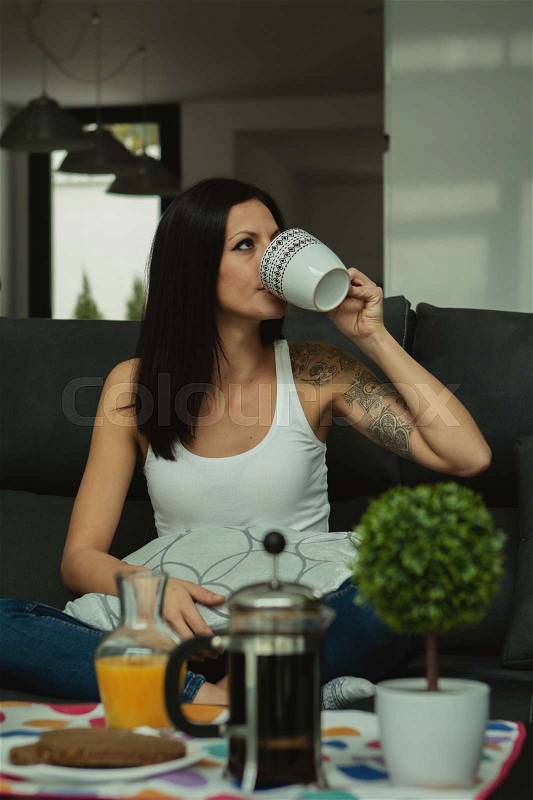 Casual girl at home take the breakfast on weekend, stock photo