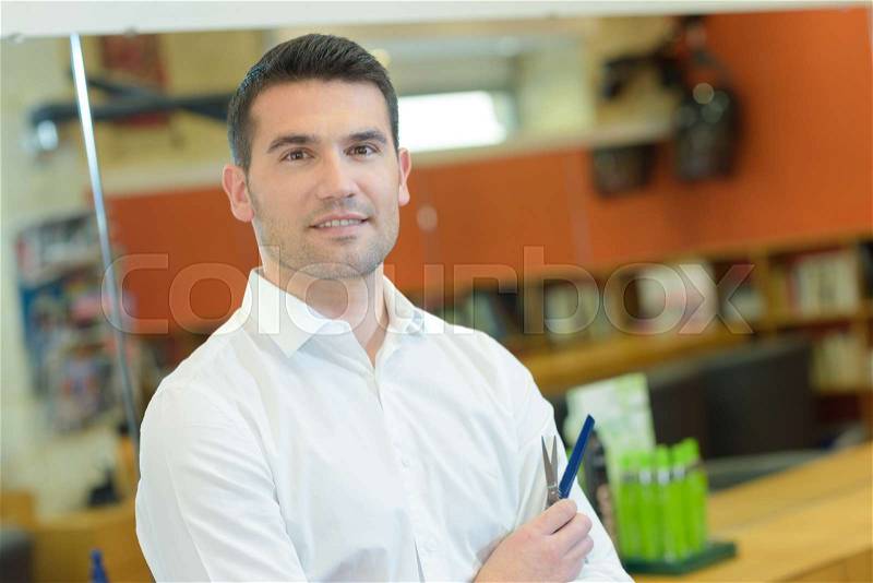 Man in a stationery shop, stock photo