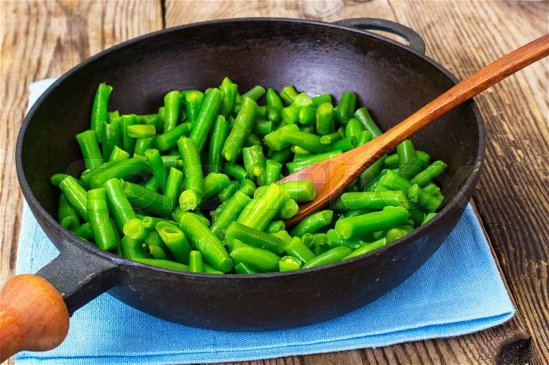 Green Beans on cast-iron frying pan. Studio Photo, stock photo