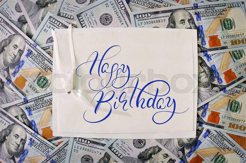 Big pile of money. stack of american dollars backgrounds with text Happy Birthday. Calligraphy lettering, stock photo
