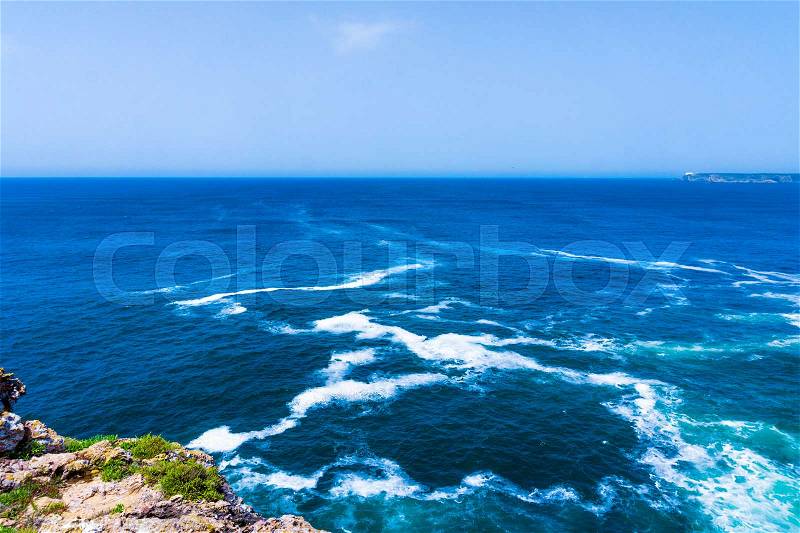 Ocean wave background. Cliff coastline in Sagres, Algarve, Portugal, stock photo