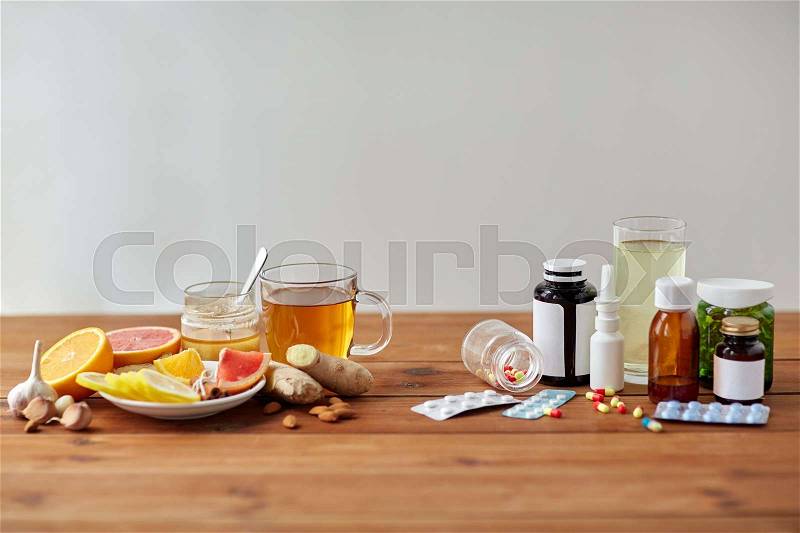 Health, traditional medicine and ethnoscience concept - natural and synthetic drugs on wooden table, stock photo
