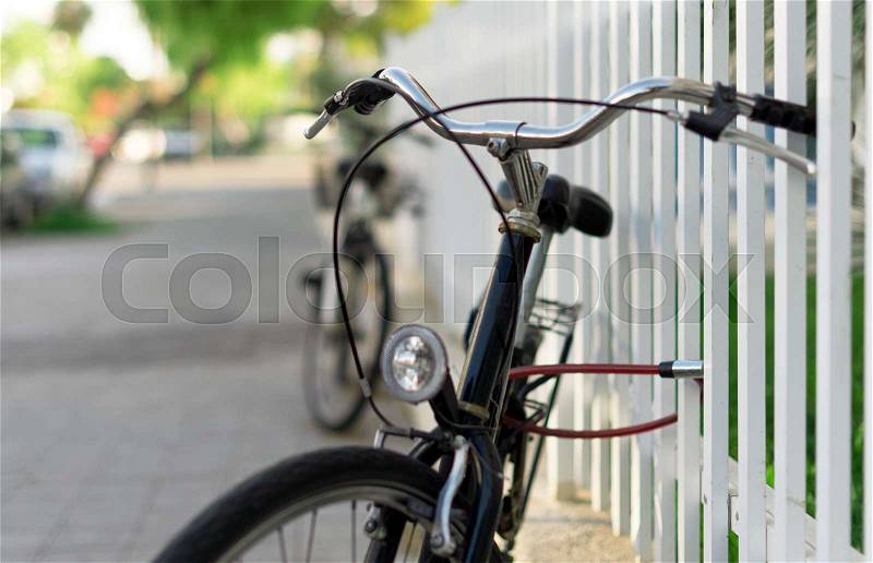 Bicycle locked up on the street , stock photo