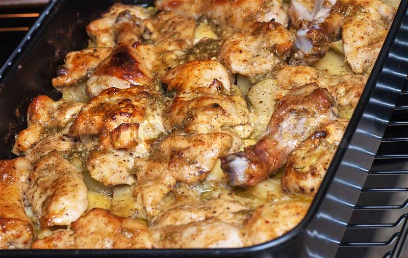 Grilled chicken with potatoes on the plate, stock photo