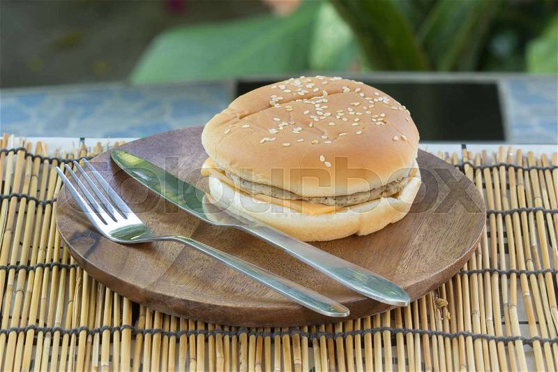 Pork Cheese Burger on the wooden plate, stock photo