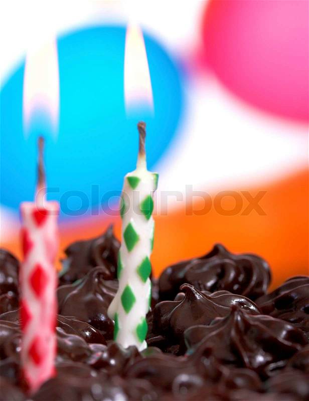 Celebrating A Two Year Old Birthday Party With Candles And Balloons, stock photo