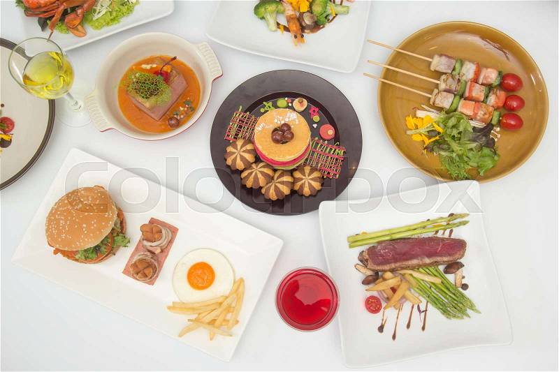 International food for dinner on white table, stock photo