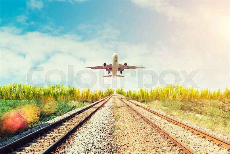 Airplane and railway at sunset. Travel or Transporttation background concept, stock photo
