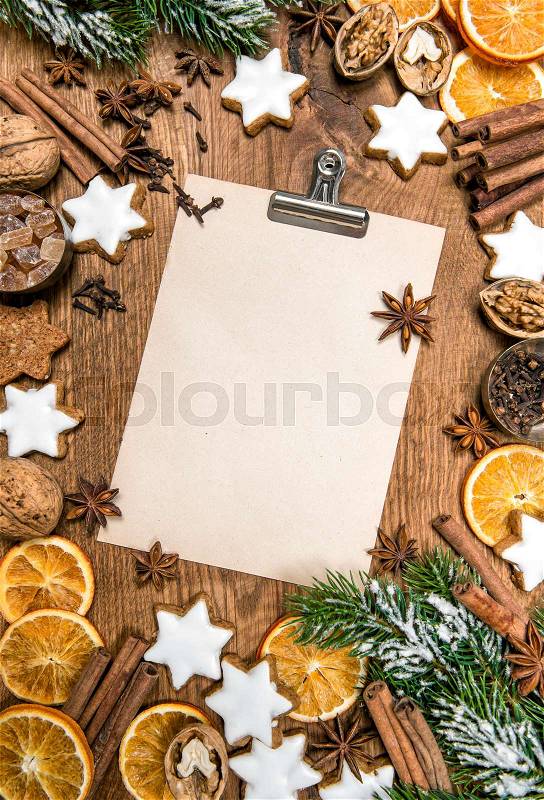 Christmas cookies and spices. Holidays food. Recipe book paper sheet, stock photo