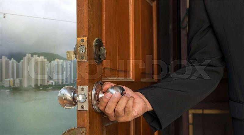 Businessman open the door to new world building and sea on hong kong - can use to display or montage on products, stock photo