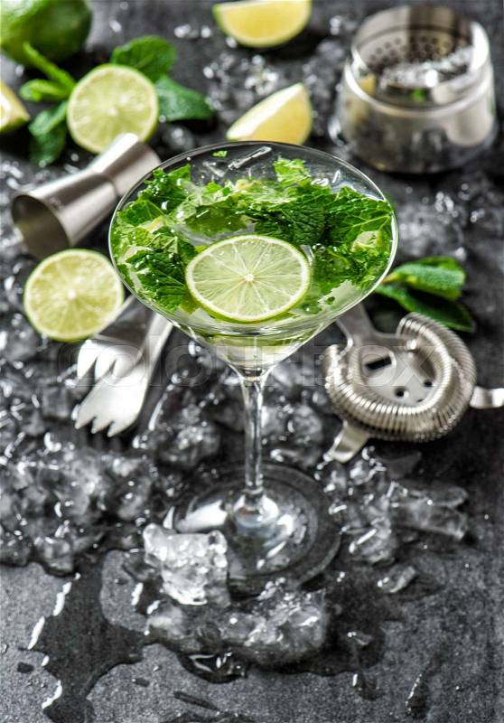Cocktail drink with lime, mint and ice. Bar tolls and ingredients, stock photo