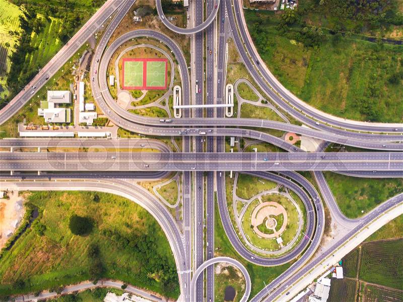 Top view over the road and highway, Aerial shot of highway interchange of a city, Shot from drone, stock photo