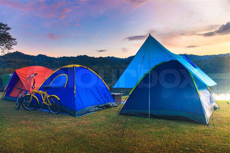 Holiday camping with twilight background in morning sunrise, stock photo